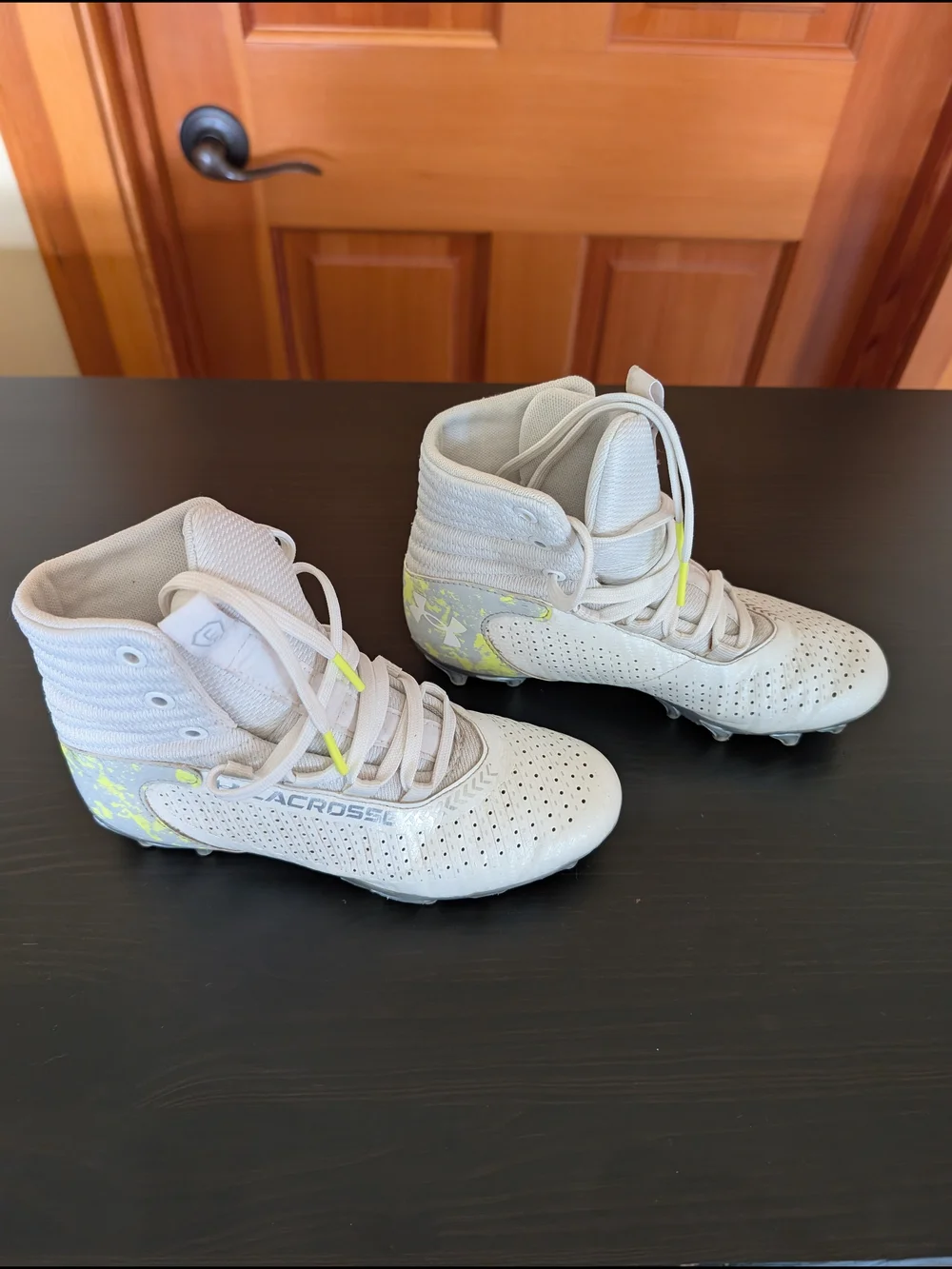 Under Armour Kids White High-Top Cleats with Neon Yellow Accent